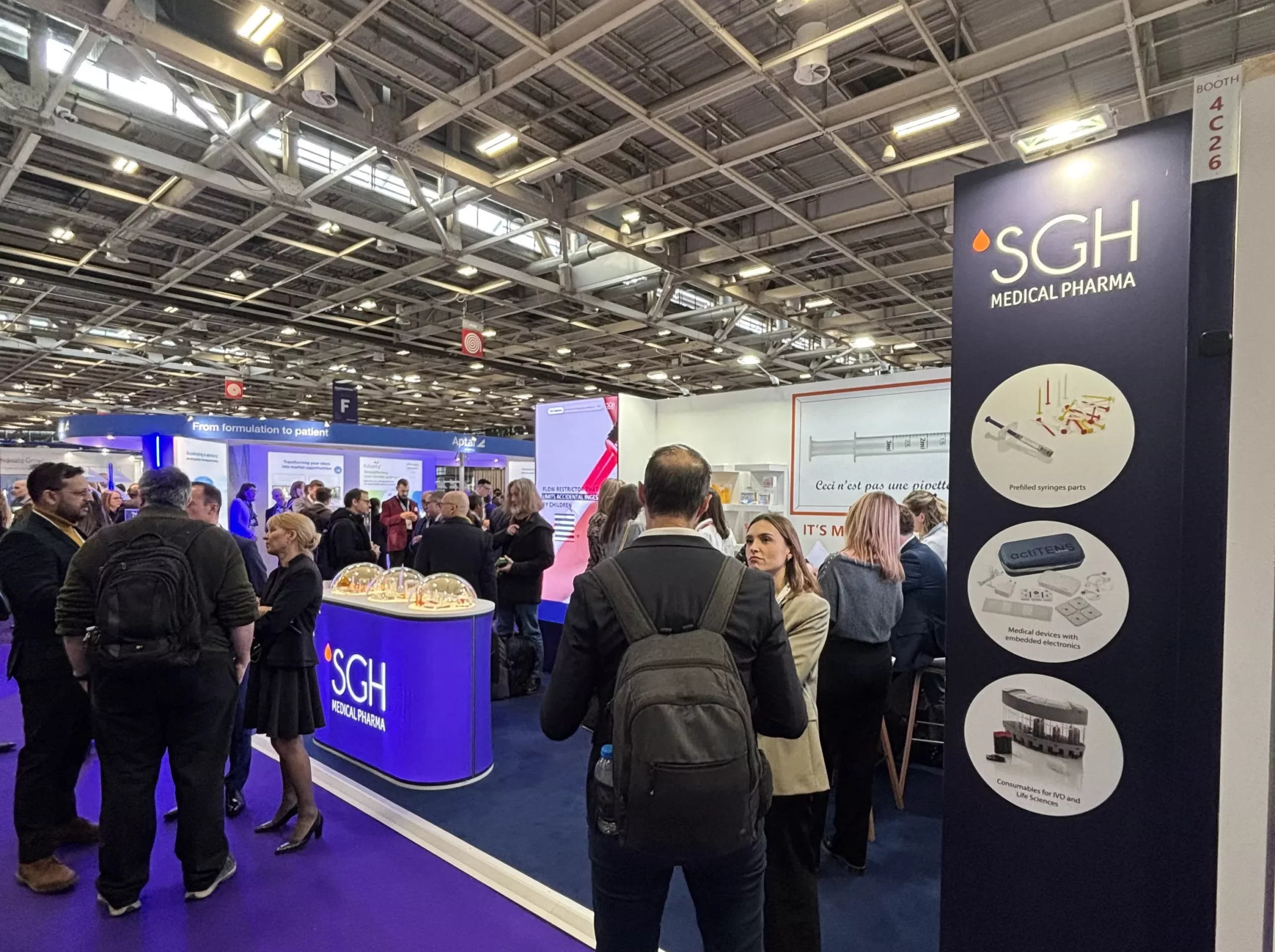 visitors to the SGH Medical Pharma booth at the Pharmapack trade show